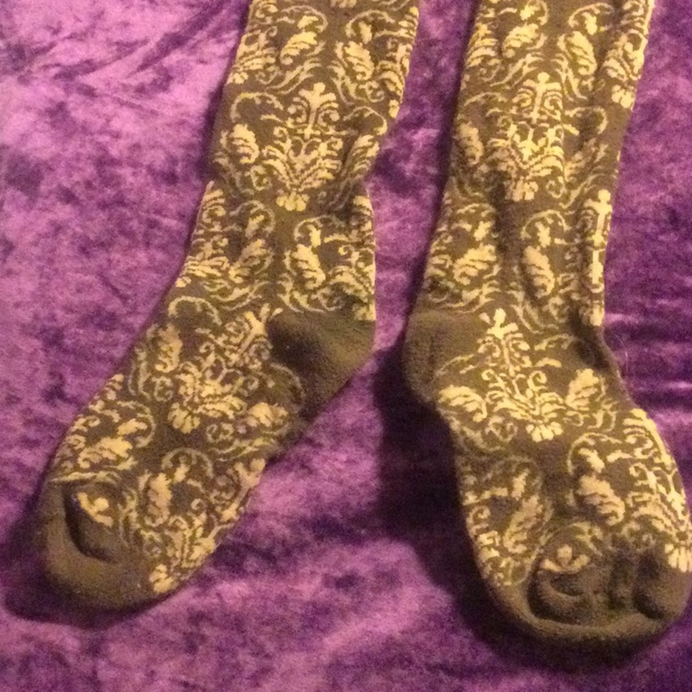 Brown socks with lace trim, floral accents, buttons